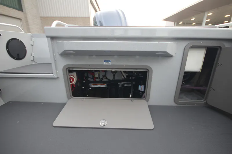 Slide: The Image of 2026 Weldcraft 240 Ocean King F300XCB boat interior, showcasing spacious deck and seating area. - 9