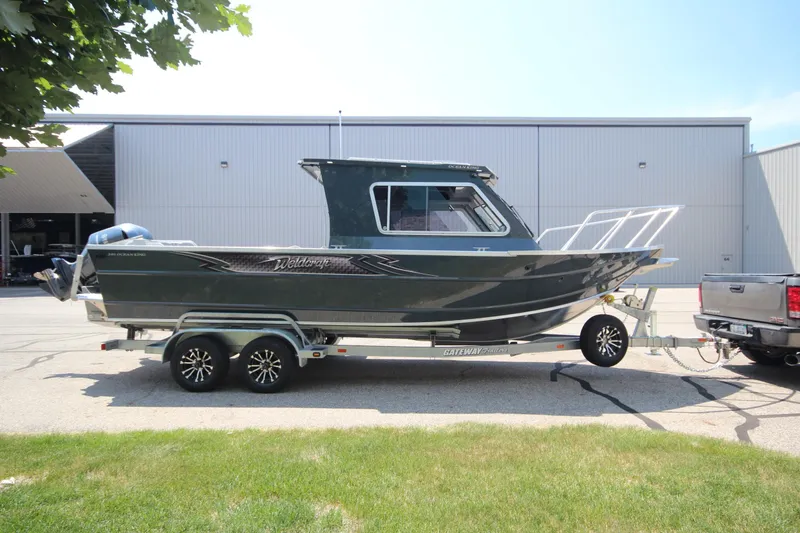 The Image of 2026 Weldcraft 240 Ocean King F300XCB boat in showroom, side view. - 0