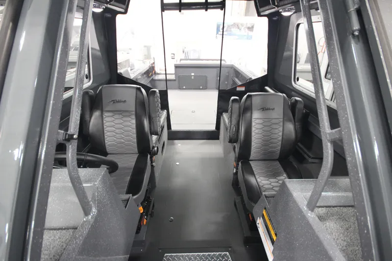 Slide: The Image of Interior of 2026 Weldcraft 240 Ocean King F300XCB boat, featuring sleek seating and modern design. - 34