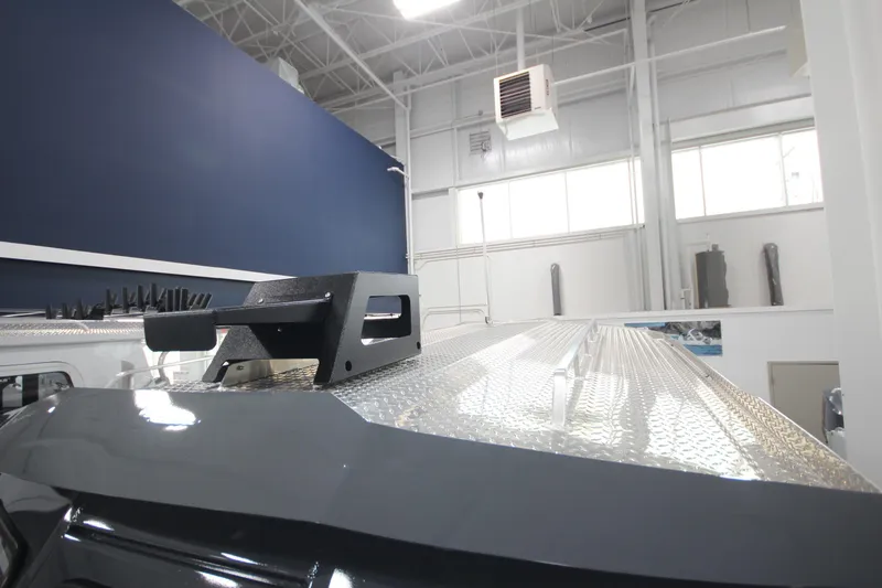 Slide: The Image of 2026 Weldcraft 240 Ocean King F300XCB boat detail in showroom, featuring metallic surface. - 36