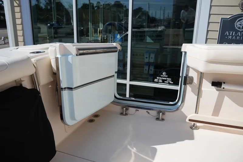 Slide: The Image of 2021 Grady-White Canyon 326 boat interior with open transom door. - 11