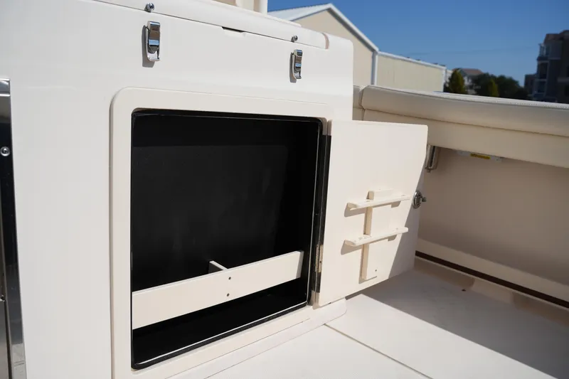 Slide: The Image of Open storage compartment on 2021 Grady-White Canyon 326 boat deck. - 15