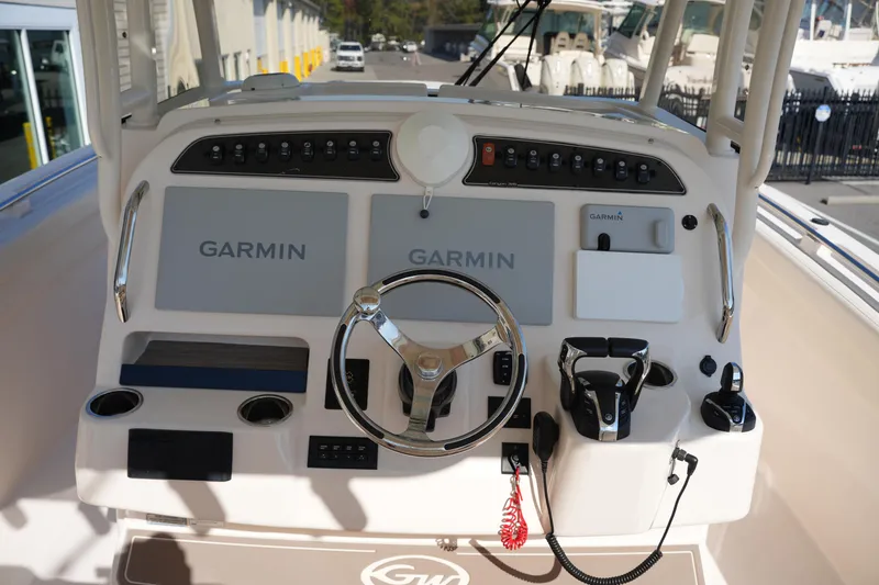 Slide: The Image of 2021 Grady-White Canyon 326 boat dashboard with Garmin navigation system. - 18