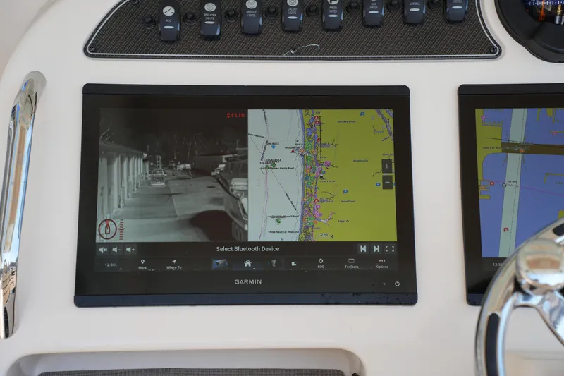 Slide: The Image of Garmin navigation display on 2021 Grady-White Canyon 326 boat dashboard. - 20