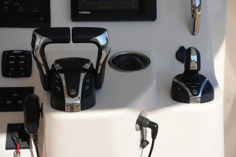 Slide: The Image of Control panel of 2021 Grady-White Canyon 326 boat with Yamaha throttle and joystick. - 24