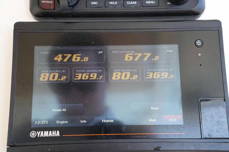 Slide: The Image of Yamaha display showing fuel usage and trip data for 2021 Grady-White Canyon 326. - 30