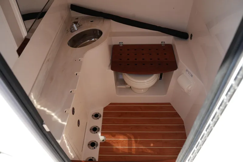 Slide: The Image of 2021 Grady-White Canyon 326 boat interior with sink and toilet. - 32