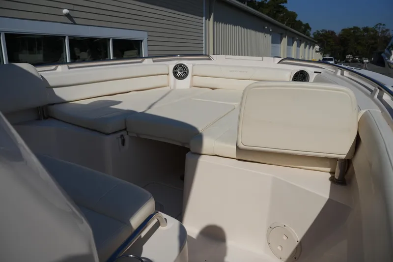 Slide: The Image of 2021 Grady-White Canyon 326 boat interior with cushioned seating and speaker system. - 33