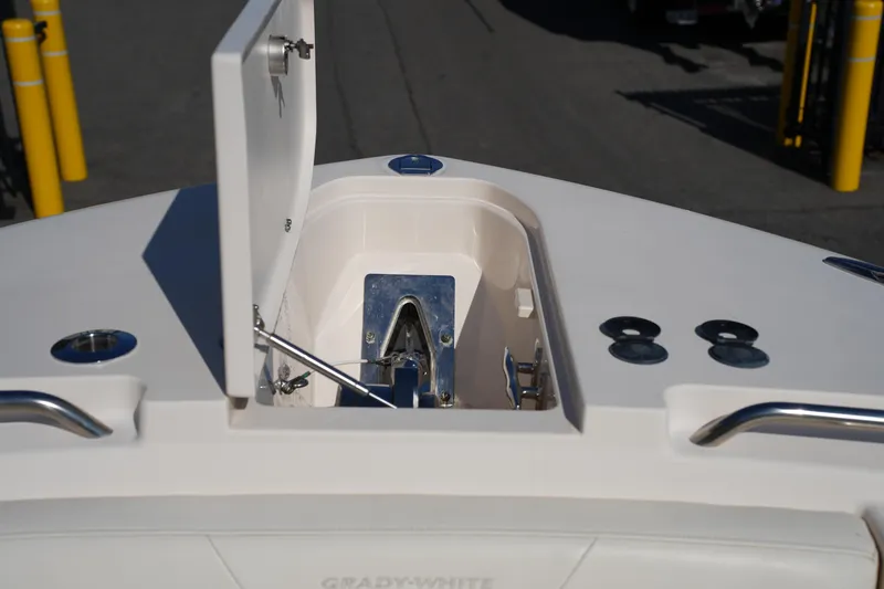 Slide: The Image of 2021 Grady-White Canyon 326 boat anchor compartment, open lid, stainless steel fittings. - 37