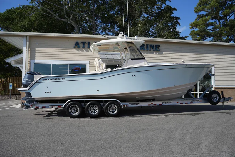 Slide: The Image of 2021 Grady-White Canyon 326 boat on trailer outside marine dealership. - 6