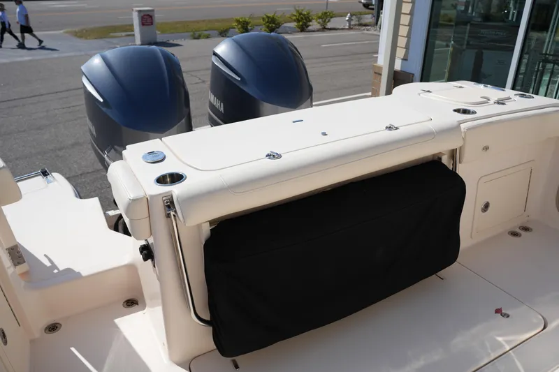 Slide: The Image of 2021 Grady-White Canyon 326 boat with dual Yamaha engines, rear seating view. - 8