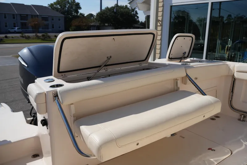 Slide: The Image of 2021 Grady-White Canyon 326 boat interior with foldable seating and storage compartments. - 9