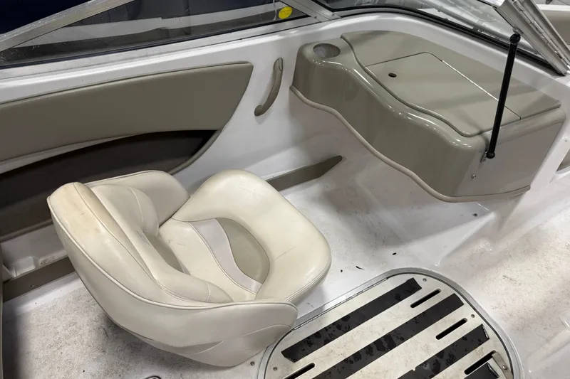 Slide: The Image of Interior of 1999 Four Winns 170 Horizon LE boat with white seating and dashboard. - 11