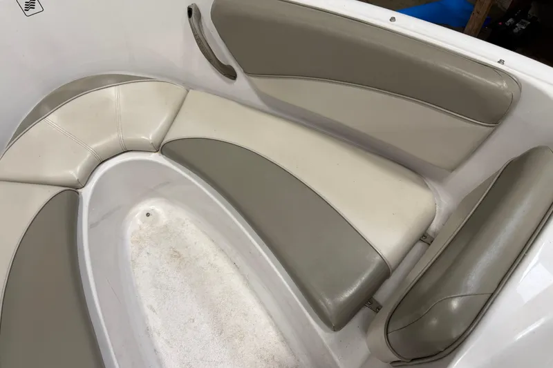 Slide: The Image of 1999 Four Winns 170 Horizon LE boat interior with beige and gray seating. - 15
