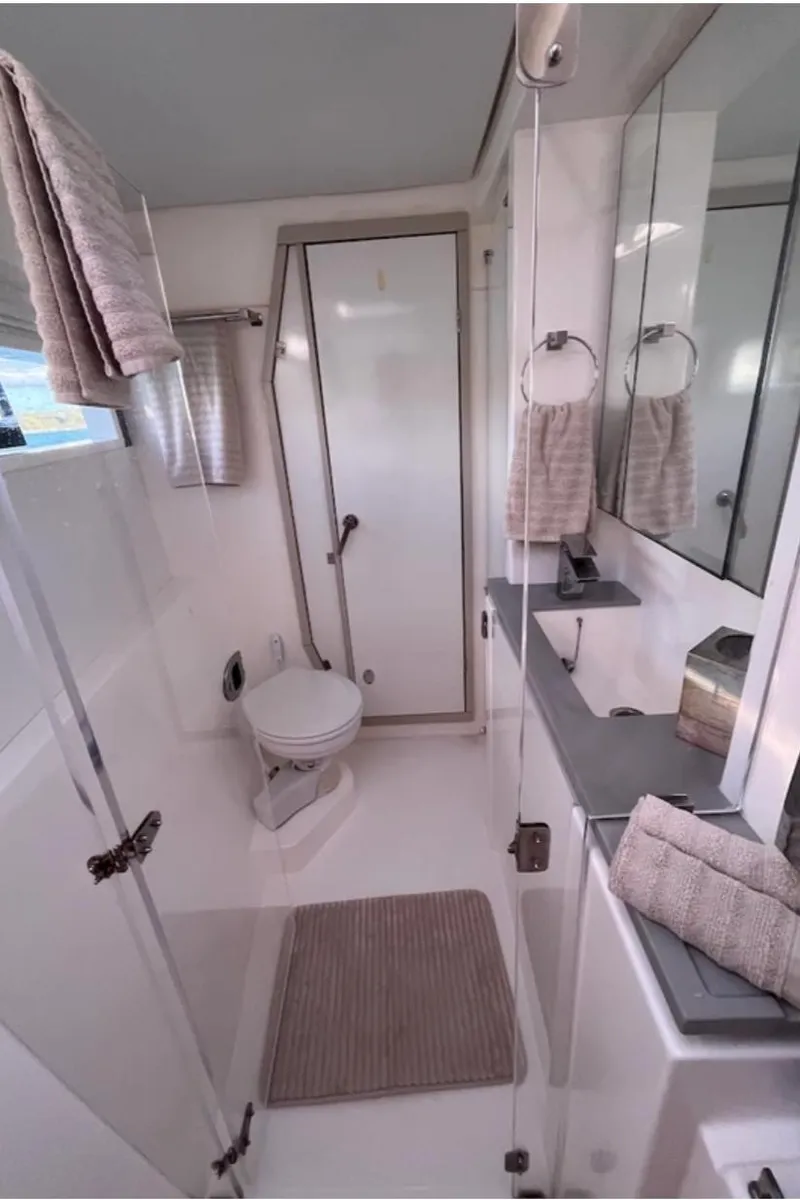 Slide: The Image of Modern bathroom in a 2018 Leopard 40 yacht with sleek fixtures and neutral decor. - 18