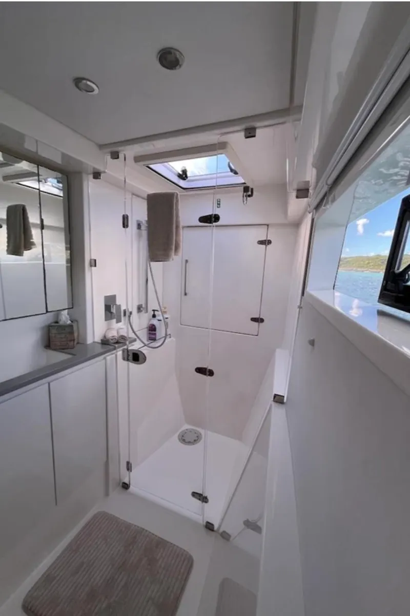 Slide: The Image of Modern bathroom on 2018 Leopard 40 yacht with glass shower and ocean view. - 23