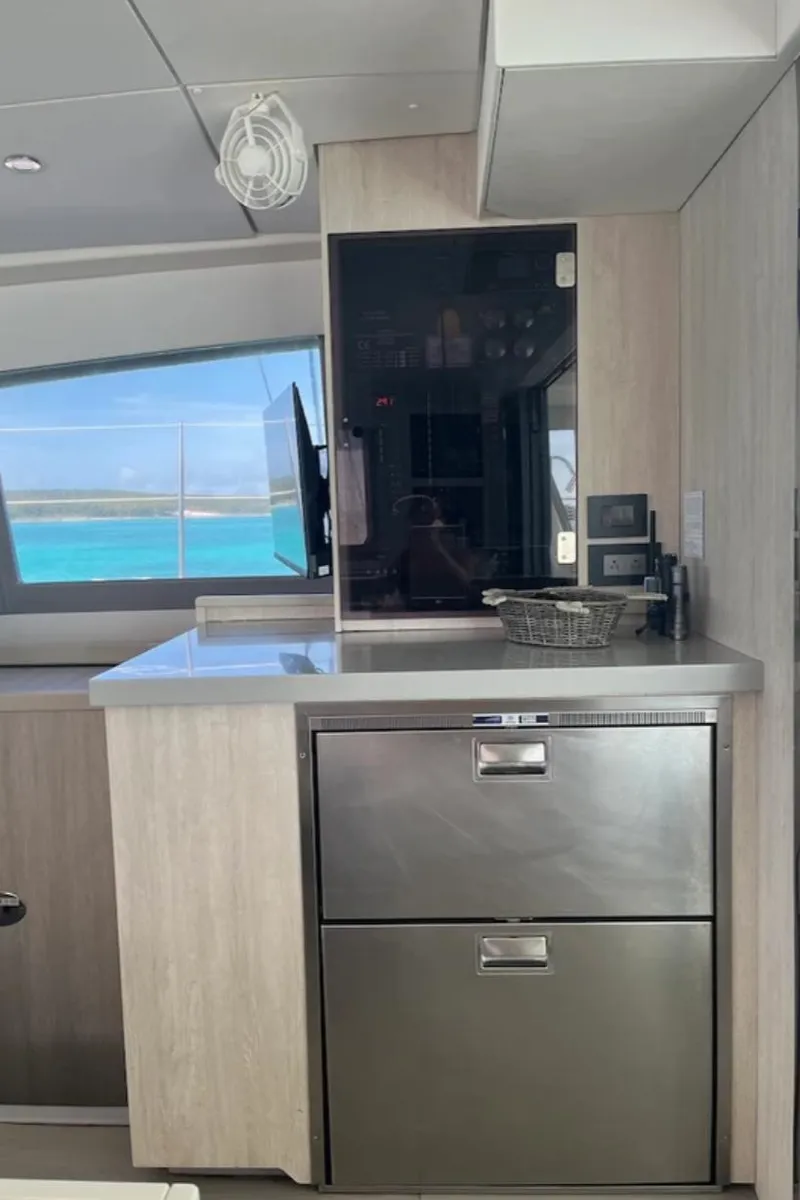 Slide: The Image of Modern kitchen area in a 2018 Leopard 40 yacht with stainless steel appliances. - 27