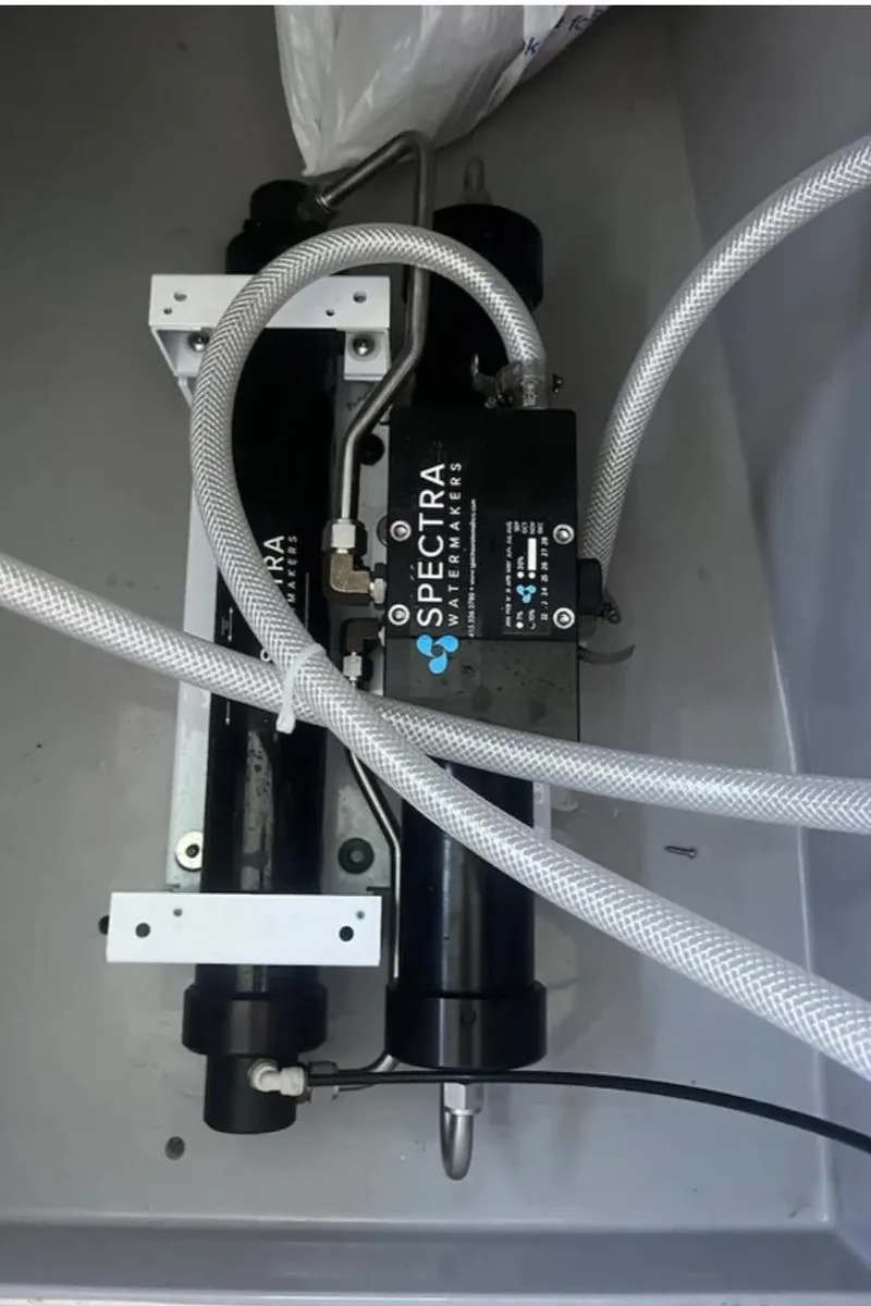Slide: The Image of Spectra watermaker system in a 2018 Leopard 40 yacht, featuring hoses and components. - 32
