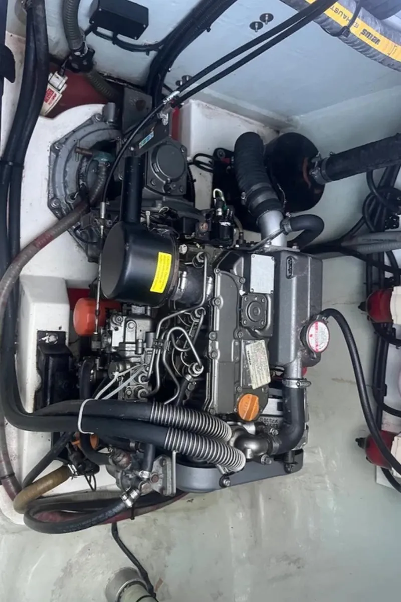 Slide: The Image of Engine compartment of a 2018 Leopard 40 catamaran, showcasing detailed mechanical components. - 34