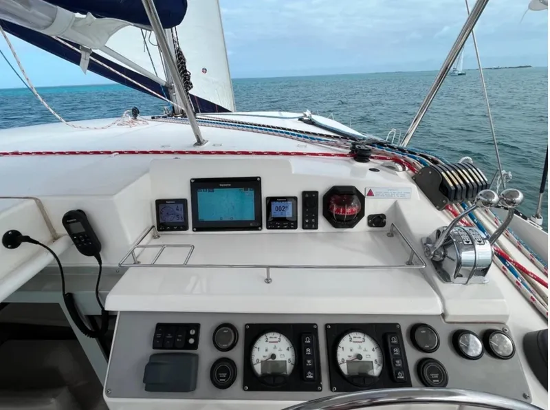 Slide: The Image of Control panel of a 2018 Leopard 40 catamaran sailing on open water. - 6