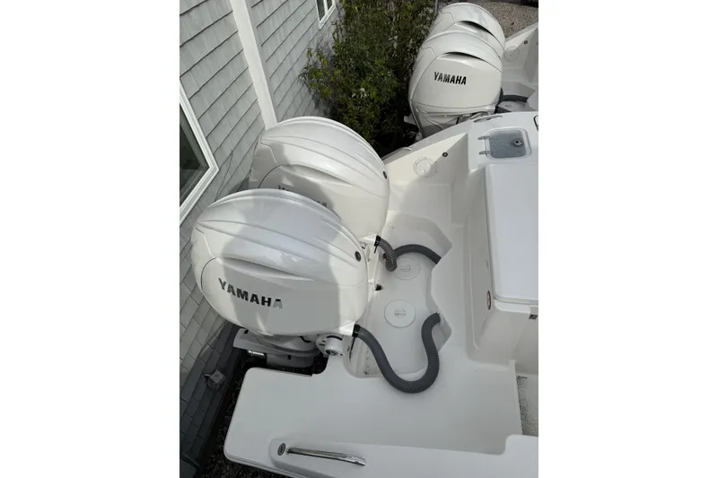 Slide: The Image of 2026 Pursuit DC 266 Dual Console with twin Yamaha outboard engines. - 4