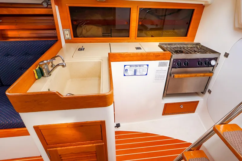Slide: The Image of 1999 J Boats J/32 yacht interior with kitchen sink and stove. - 21
