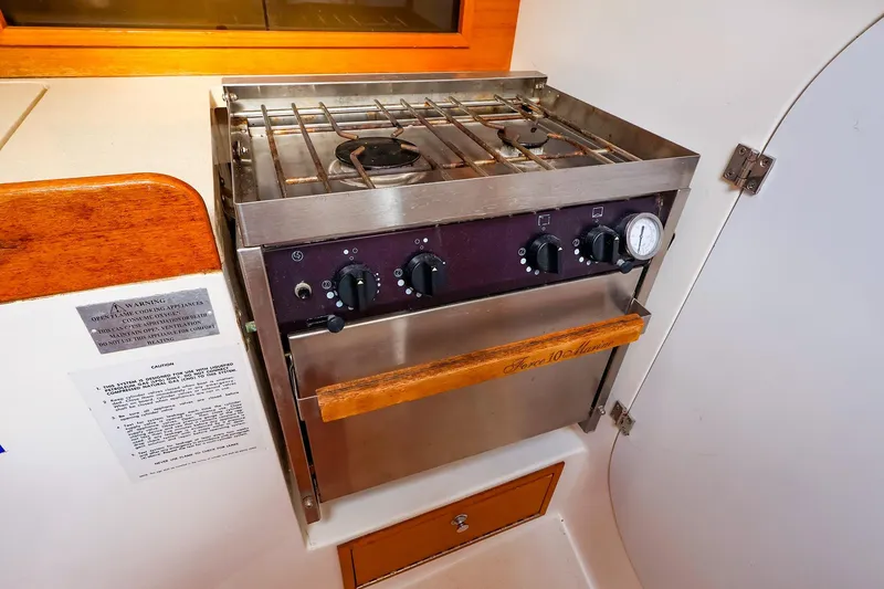Slide: The Image of Stainless steel stove and oven in 1999 J Boats J/32 yacht galley. - 22