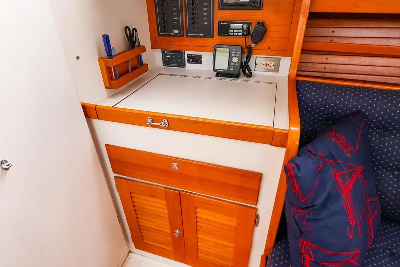 Slide: The Image of 1999 J Boats J/32 interior with navigation station and wooden cabinetry. - 23
