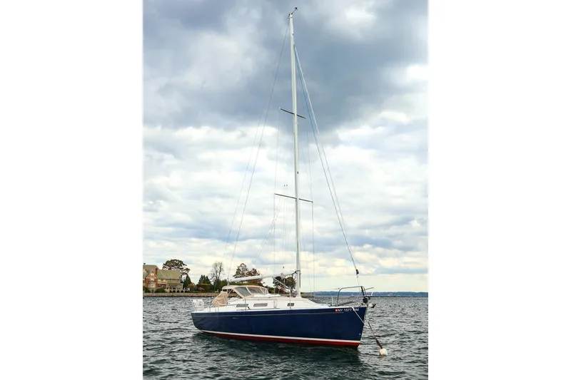 Slide: The Image of Sailboat on water, 1999 J Boats J/32 model, under cloudy sky. - 5