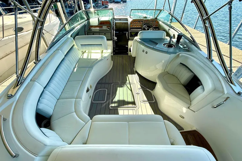 Slide: The Image of Luxurious interior of a 2007 Cobalt 323 boat with white seating and wood flooring. - 16