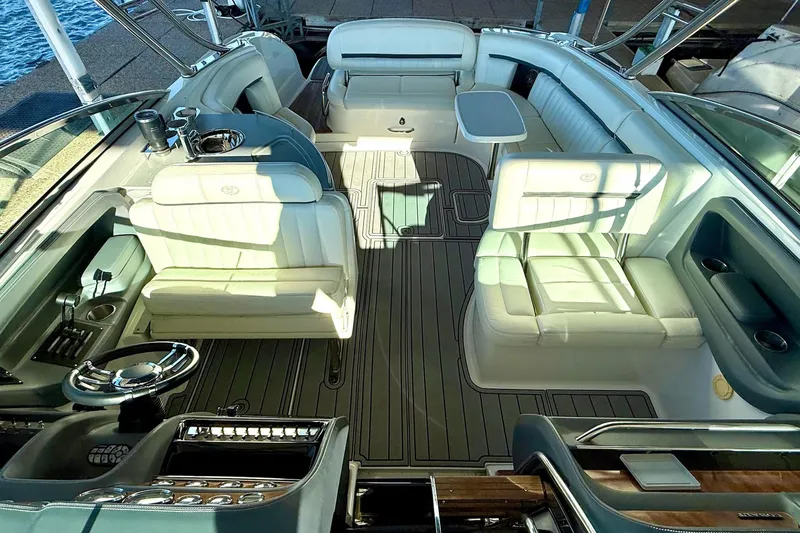 Slide: The Image of Luxurious interior of a 2007 Cobalt 323 boat with elegant seating and steering area. - 18