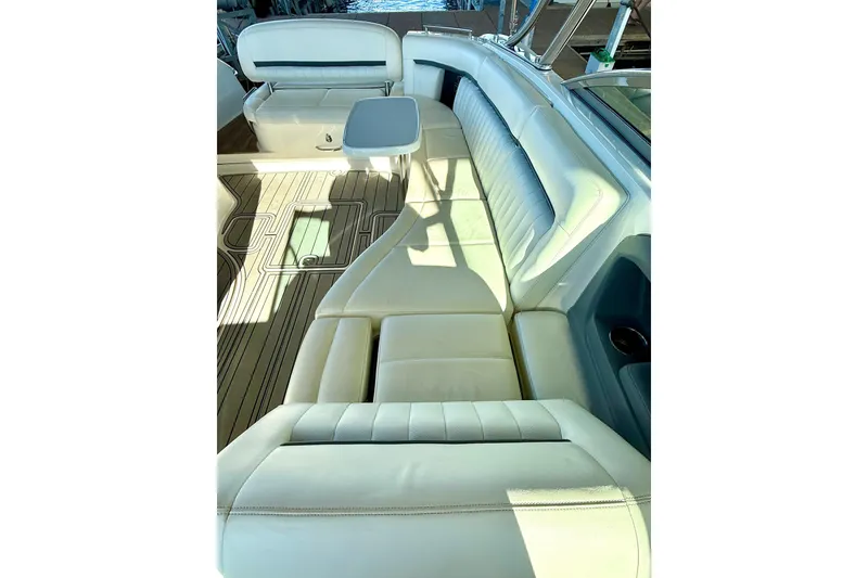 Slide: The Image of Luxurious interior of a 2007 Cobalt 323 boat with white leather seating. - 19