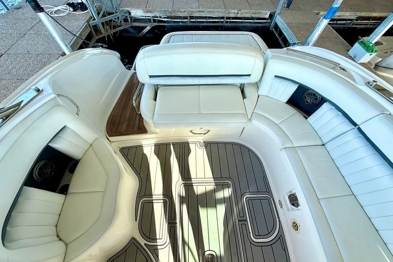 Slide: The Image of Luxurious interior of a 2007 Cobalt 323 boat with white seating and sleek flooring. - 21