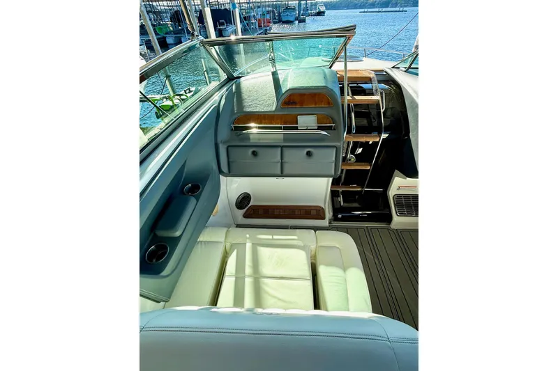 Slide: The Image of Interior view of a 2007 Cobalt 323 boat, featuring luxurious seating and helm. - 25