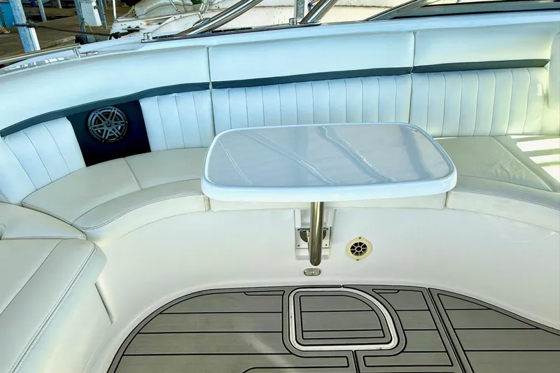 Slide: The Image of Luxurious seating area on a 2007 Cobalt 323 boat with a sleek table. - 27