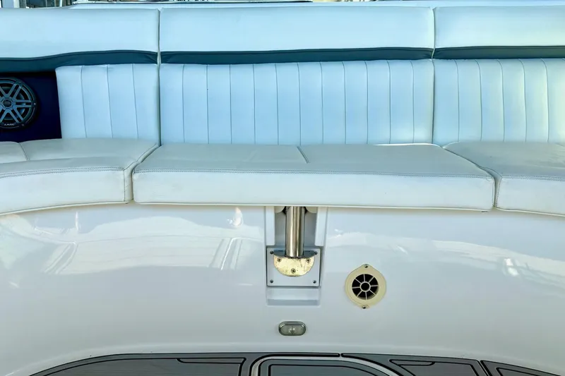 Slide: The Image of 2007 Cobalt 323 boat interior with white cushioned seating and speaker detail. - 28