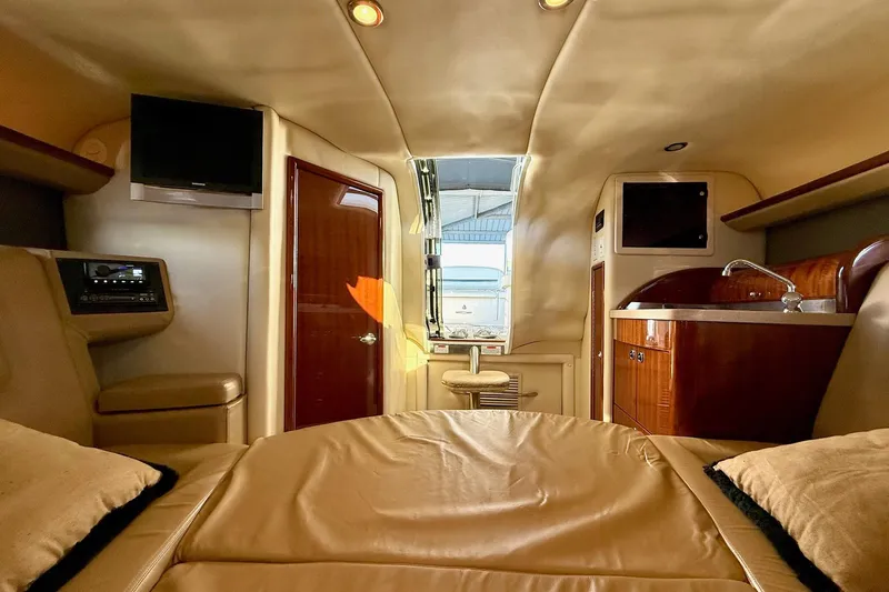 Slide: The Image of Luxurious interior of a 2007 Cobalt 323 boat featuring a cozy cabin and modern amenities. - 32