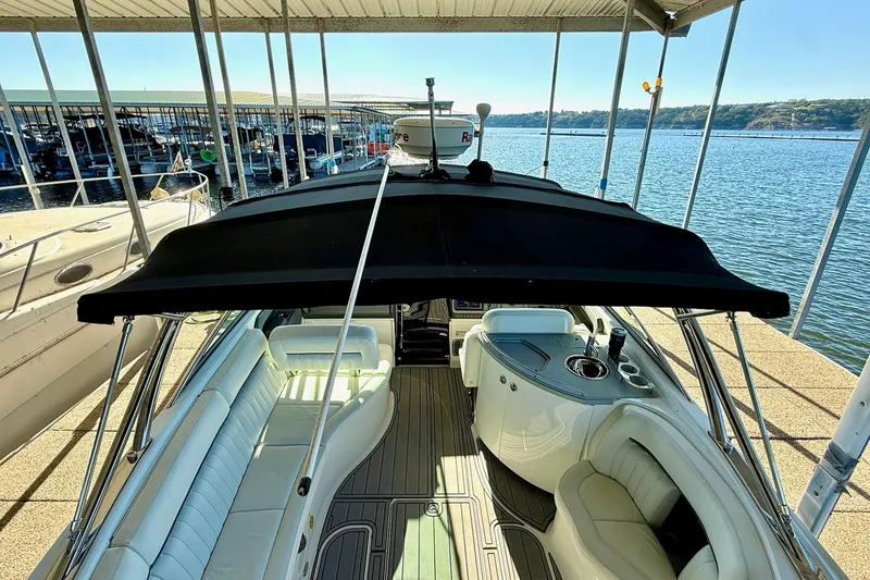 Slide: The Image of 2007 Cobalt 323 boat with sleek interior docked at a marina. - 39