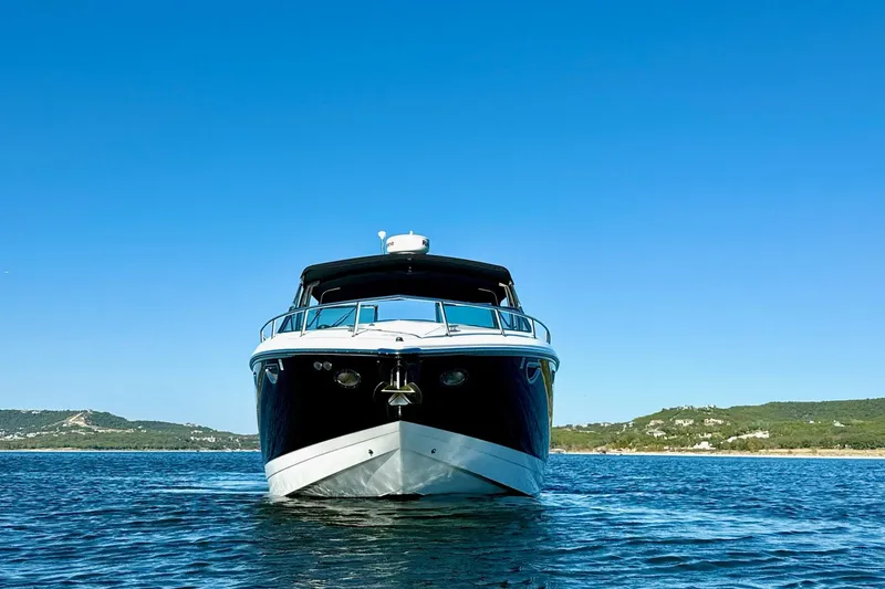 Slide: The Image of Front view of a 2007 Cobalt 323 boat on a clear blue lake. - 7