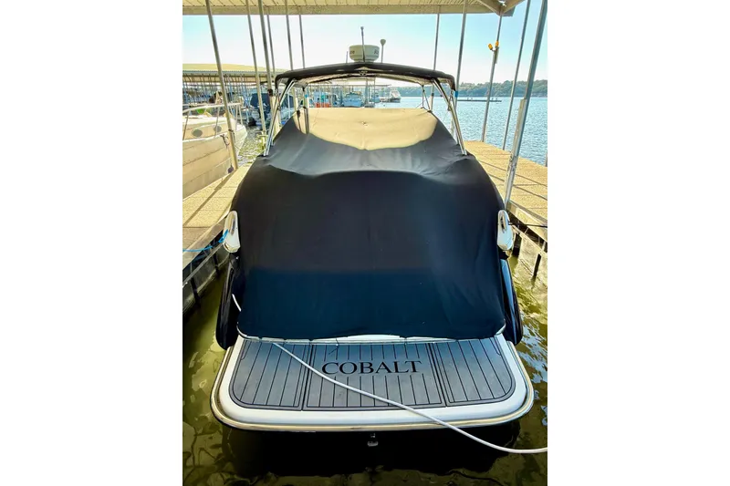 Slide: The Image of 2007 Cobalt 323 boat docked with cover, rear view. - 9