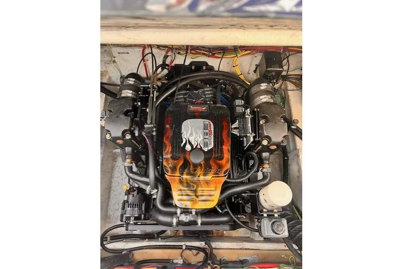 Slide: The Image of Engine of a 2003 Bayliner 285 boat with custom flame design. - 24