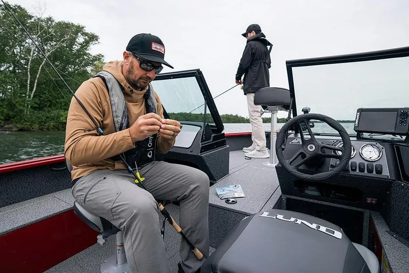 Slide: The Image of Manufacturer Provided Image: Two people fishing on a 2026 Lund 1800 Explorer Sport boat. - 17