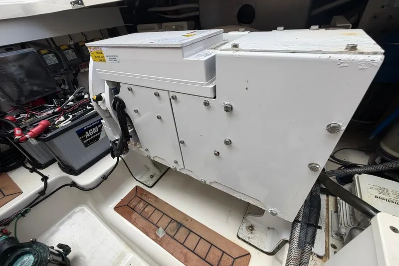 Slide: The Image of Engine compartment of a Boston Whaler 405 Conquest with AGM battery and wiring and Seakeeper. - 52