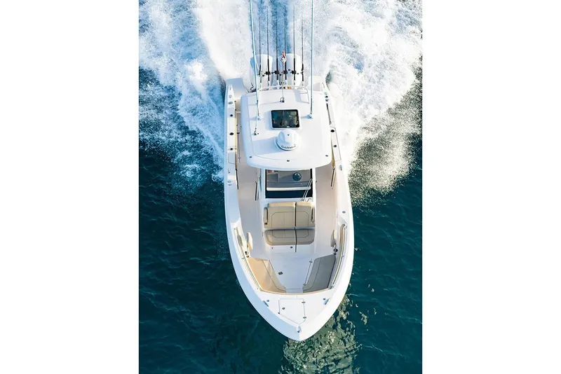 Slide: The Image of Manufacturer Provided Image: Aerial view of 2025 Pursuit S 288 Sport boat cruising on blue water. - 14