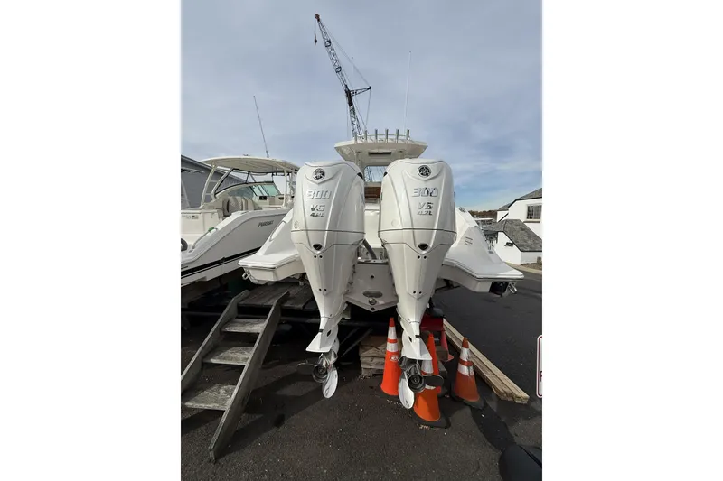 Slide: The Image of 2026 Pursuit S 288 Sport boat with dual 300 V6 outboard engines on display. - 3