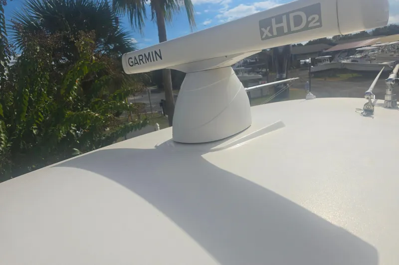 Slide: The Image of Garmin xHD2 radar on 2017 Cobia 296 Center Console boat under sunny sky. - 12