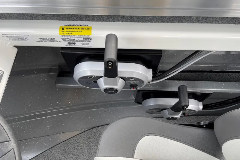 Slide: The Image of 2024 Spartan 185 Astoria boat controls with seating and capacity label. - 13