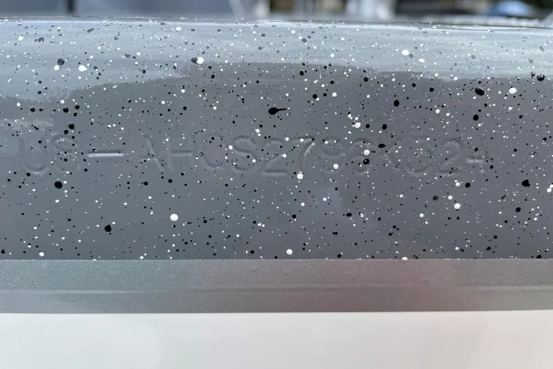 Slide: The Image of 2024 Spartan 185 Astoria with speckled gray finish and embossed serial number. - 44