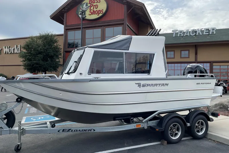 Slide: The Image of 2024 Spartan 185 Astoria boat on trailer outside Bass Pro Shops. - 6