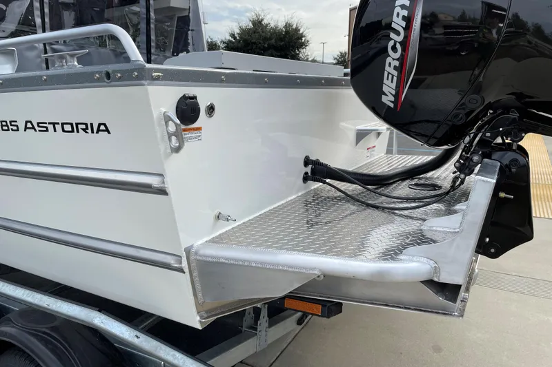 Slide: The Image of 2024 Spartan 185 Astoria boat with Mercury outboard motor, featuring aluminum deck. - 7